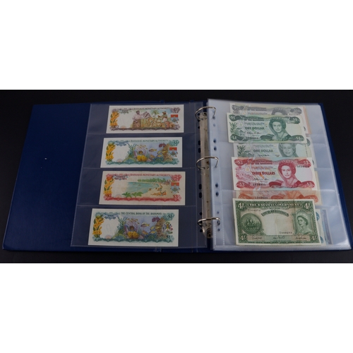 454 - British Commonwealth (90), a good group of Queen Elizabeth II portrait notes in an album, Bahamas (1... 