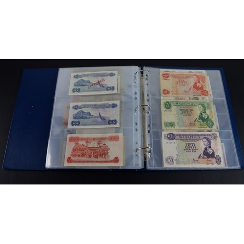 454 - British Commonwealth (90), a good group of Queen Elizabeth II portrait notes in an album, Bahamas (1... 