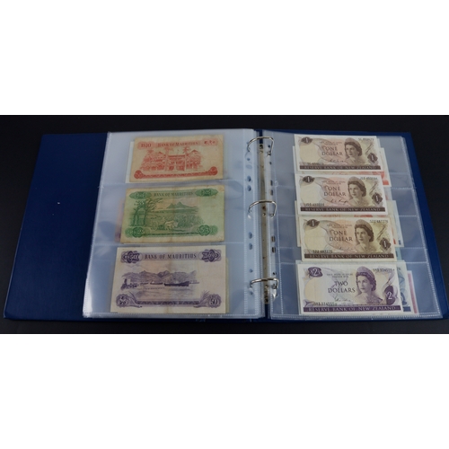 454 - British Commonwealth (90), a good group of Queen Elizabeth II portrait notes in an album, Bahamas (1... 