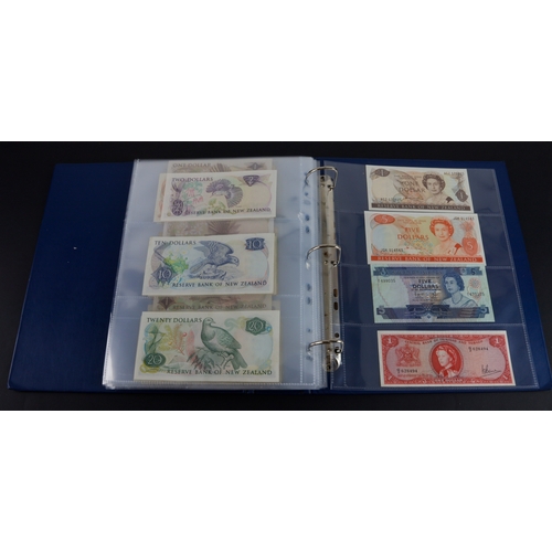454 - British Commonwealth (90), a good group of Queen Elizabeth II portrait notes in an album, Bahamas (1... 
