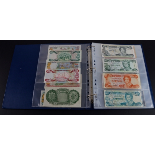 454 - British Commonwealth (90), a good group of Queen Elizabeth II portrait notes in an album, Bahamas (1... 