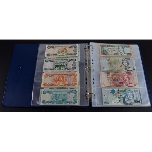 454 - British Commonwealth (90), a good group of Queen Elizabeth II portrait notes in an album, Bahamas (1... 