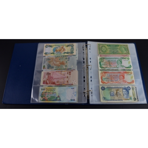 454 - British Commonwealth (90), a good group of Queen Elizabeth II portrait notes in an album, Bahamas (1... 