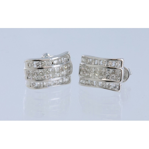 248 - White metal (stamped 18ct) diamond stud earrings, each earring set with eighteen princess cuts in in... 