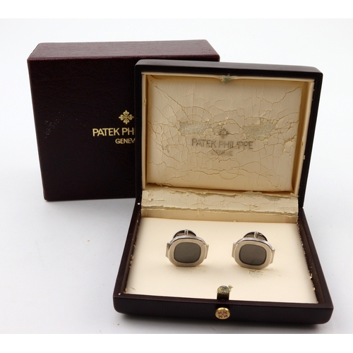 257 - Patek Philippe, a pair of Nautilus 18ct white gold and onyx cufflinks, folding terminals, signed to ... 