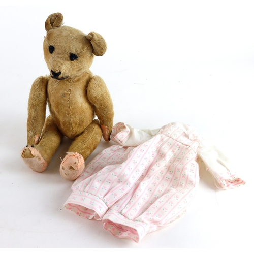 245 - Teddy Bear: Early teddy bear, worn and replaced, hump back, jointed arms and legs, moveable head and... 