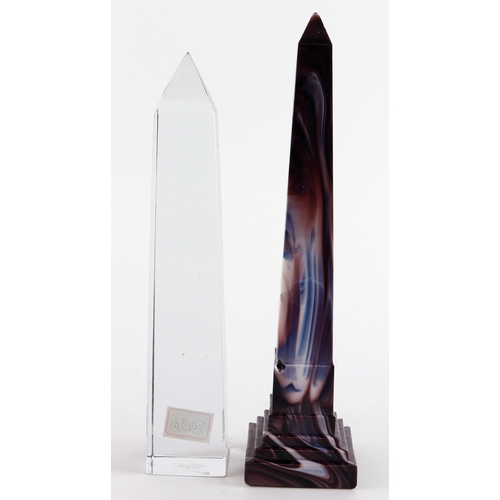 68 - Glass Obelisks (2), comprising one of slag glass with two chips to the base, and one of clear glass,... 