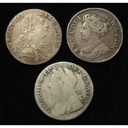 214 - Shillings (3): 1711 S.3618, GF; 1741 roses in angles, S.3701, fair, and 1787 with hearts, VF-GVF.
