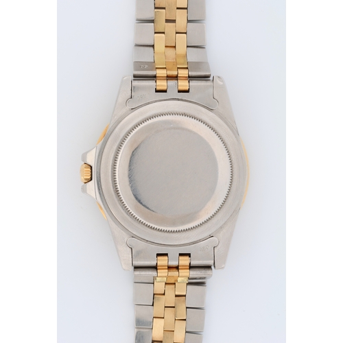 558 - Rolex Oyster Perpetual Date GMT-Master, steel and gold, ref. 16753, 8,2xx,xxx serial (1984). The bla... 