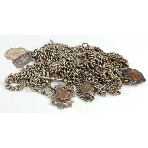 7 - Silver Albert chains (6), each of curb links, attached a variety of dog-clips, T-bars and fobs, gros... 