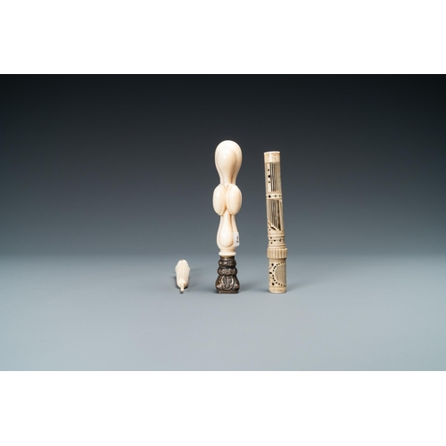 103 - An ivory 'Stanhope' miniature umbrella with microscopical views on Paris, a seal stamp and a bone ne... 