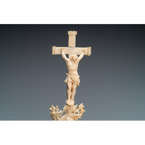 104 - An ivory crucifixion group with Mary Magdalen beneath the cross, 18th C.Lot subject to CITES-regulat... 