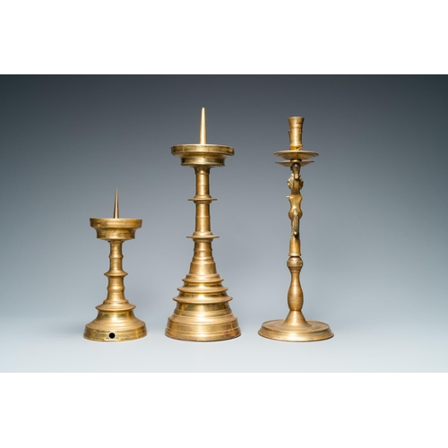 11 - Three bronze candlesticks, Flanders and Germany, 16th C.H.: 44,5 - 41,5 - 28 cm  Provenance: - The D... 