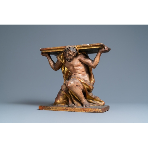 115 - A polychromed and gilded wooden console in the shape of a kneeled Atlas figure, Italy, 17th C.H.: 37... 