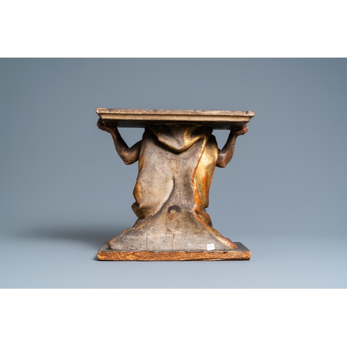 115 - A polychromed and gilded wooden console in the shape of a kneeled Atlas figure, Italy, 17th C.H.: 37... 