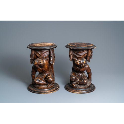 117 - A pair of patinated coniferous wood candle supports in the shape of kneeling Moors, Venice, Italy, 1... 