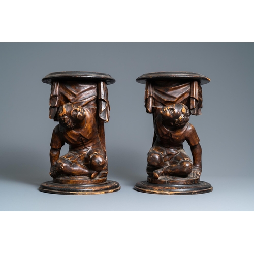 117 - A pair of patinated coniferous wood candle supports in the shape of kneeling Moors, Venice, Italy, 1... 