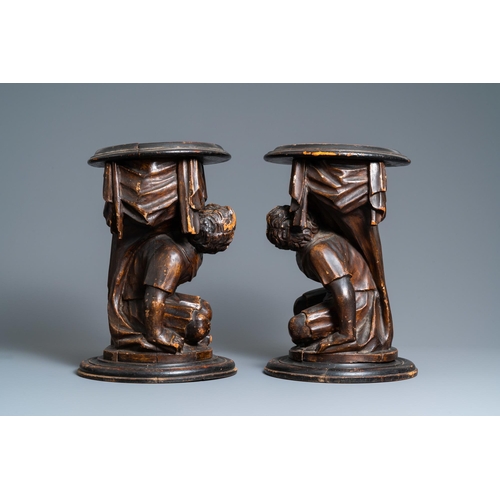 117 - A pair of patinated coniferous wood candle supports in the shape of kneeling Moors, Venice, Italy, 1... 