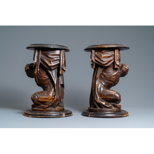 117 - A pair of patinated coniferous wood candle supports in the shape of kneeling Moors, Venice, Italy, 1... 