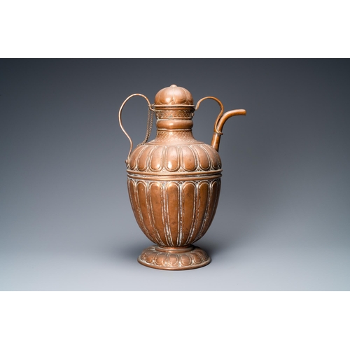 12 - A large Italian copper ewer and cover, 17th C.H.: 50,5 cm - L.: 37 cm  Provenance: - The Davioud-Lar... 