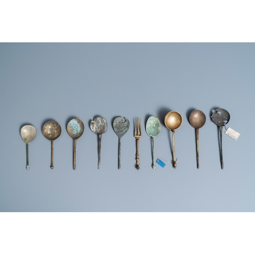 130 - Nine brass spoons and a small fork, 15/16th C.L.: 17,5 cm (the largest)  One with a label: found in ... 