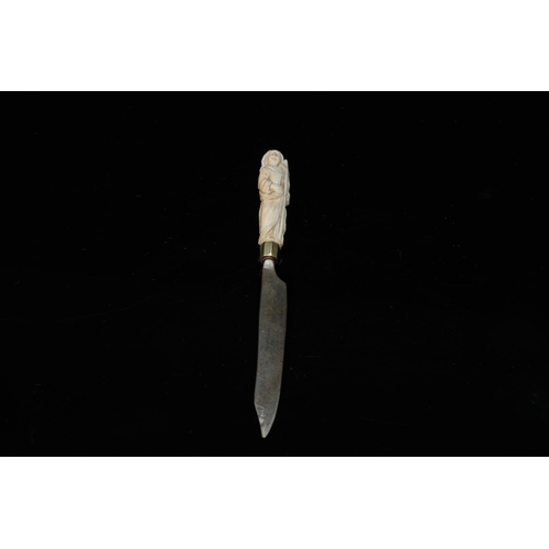 132 - An ivory-handled knife depicting the theological virtue of faith and an ivory folding tailor's ruler... 