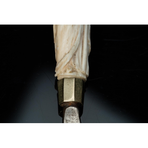 132 - An ivory-handled knife depicting the theological virtue of faith and an ivory folding tailor's ruler... 