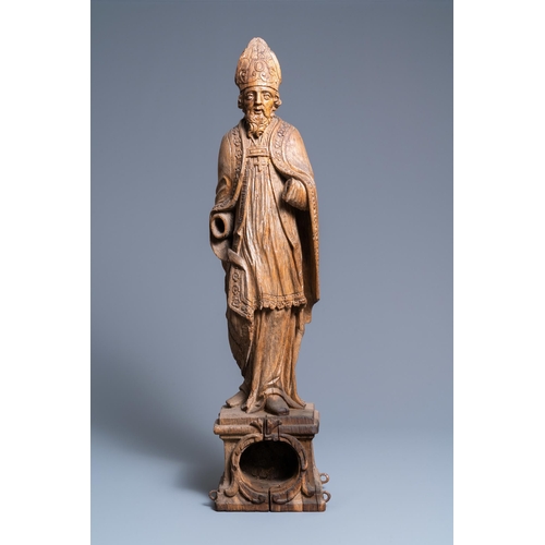 149 - A large oak figure of a bishop on a reliquary base, Flanders, 18th C.H.: 85 cm  Provenance: - The Da... 