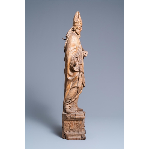 149 - A large oak figure of a bishop on a reliquary base, Flanders, 18th C.H.: 85 cm  Provenance: - The Da... 