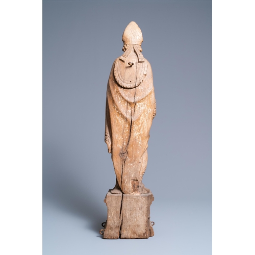 149 - A large oak figure of a bishop on a reliquary base, Flanders, 18th C.H.: 85 cm  Provenance: - The Da... 