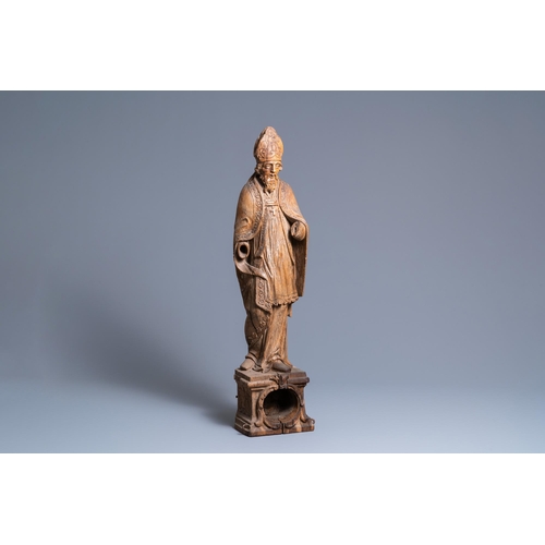 149 - A large oak figure of a bishop on a reliquary base, Flanders, 18th C.H.: 85 cm  Provenance: - The Da... 