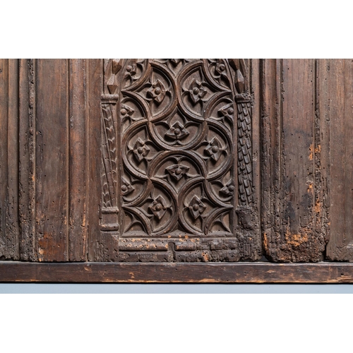 16 - A carved oak front panel of a coffer with tracery panels, 15th C.Dim.: 86,5 x 55 cm  Provenance: - T... 