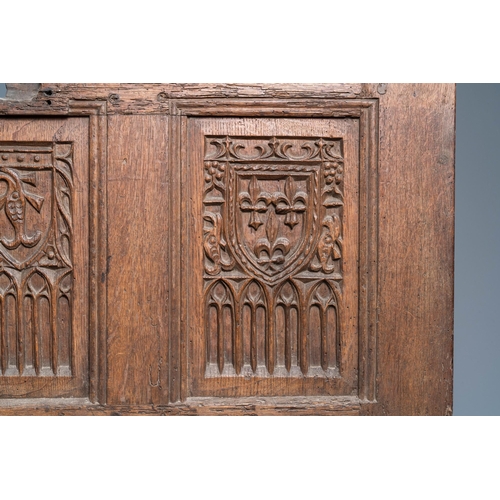 17 - A carved oak front panel of a coffer with the arms of France and the Dauphin, France, 2nd half 15th ... 