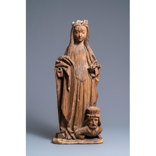 171 - An oak figure of Catherine of Alexandria, 16th C.H.: 77 cm  The head with traces of a lead crown.  P... 