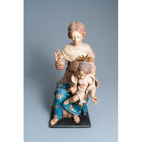 174 - A polychromed wooden figure of a Madonna with child, 17th C.H.: 88 cm (incl. stand)H.: 84,5 cm (the ... 