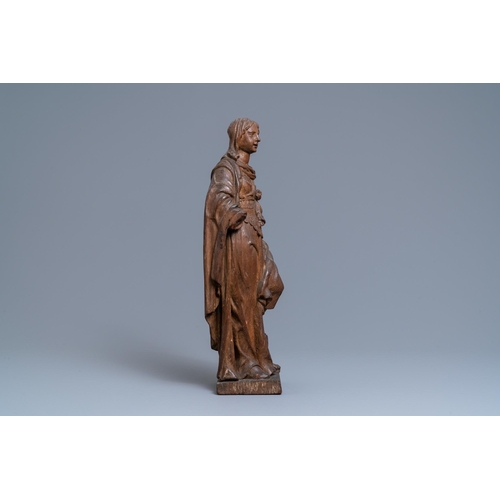 176 - An oak figure of a female saint crushing a griffin, 2nd half 16th C.H.: 55 cm  Provenance: - The Dav... 