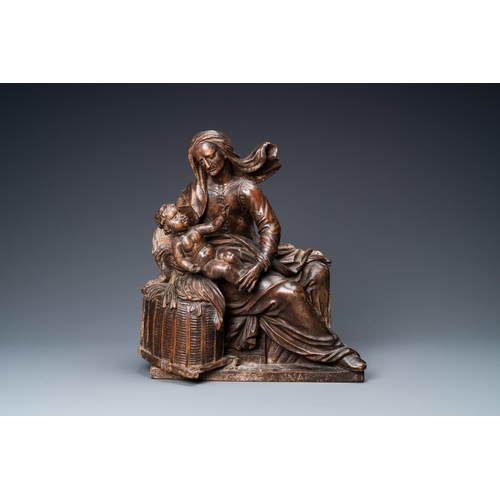 190 - A patinated wooden group of Saint Anne with the infant Jesus on an inscribed base, ca. 1540H.: 36,5 ... 