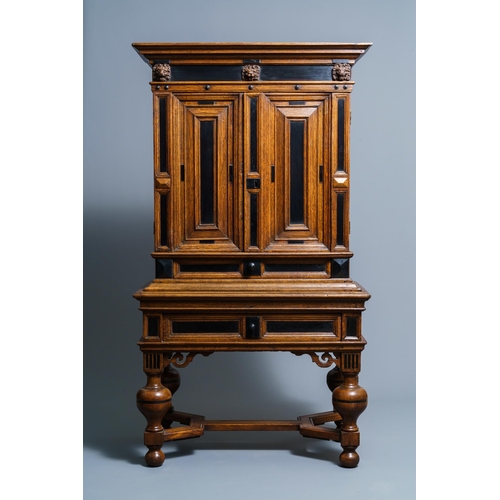 20 - An oak and ebony two-door cabinet, The Low Countries, 17th C.Dim.: 160,5 x 90 x 47 cm  Provenance: -... 