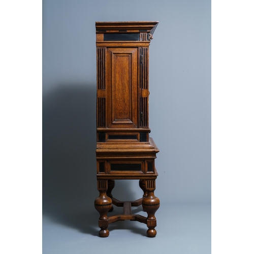 20 - An oak and ebony two-door cabinet, The Low Countries, 17th C.Dim.: 160,5 x 90 x 47 cm  Provenance: -... 