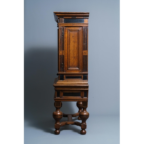 20 - An oak and ebony two-door cabinet, The Low Countries, 17th C.Dim.: 160,5 x 90 x 47 cm  Provenance: -... 