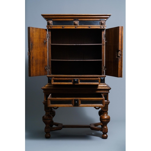 20 - An oak and ebony two-door cabinet, The Low Countries, 17th C.Dim.: 160,5 x 90 x 47 cm  Provenance: -... 