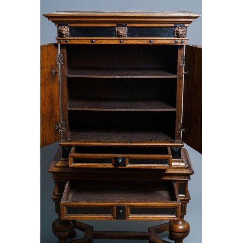 20 - An oak and ebony two-door cabinet, The Low Countries, 17th C.Dim.: 160,5 x 90 x 47 cm  Provenance: -... 