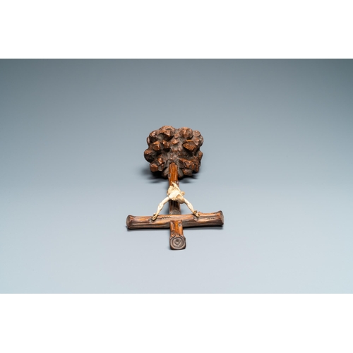 31 - An ivory Corpus Christi on naturalistically carved wooden crucifix, probably France, 17/18th C.Lot s... 