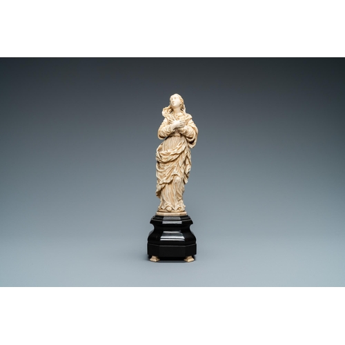 47 - An ivory figure of a Madonna on wooden stand, Flanders or Germany, 17th C.Lot subject to CITES-regul... 