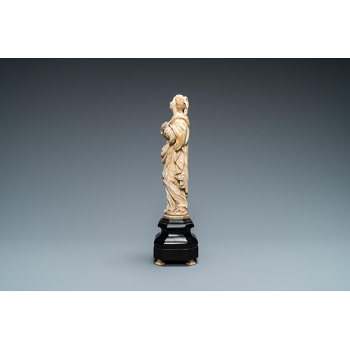 47 - An ivory figure of a Madonna on wooden stand, Flanders or Germany, 17th C.Lot subject to CITES-regul... 