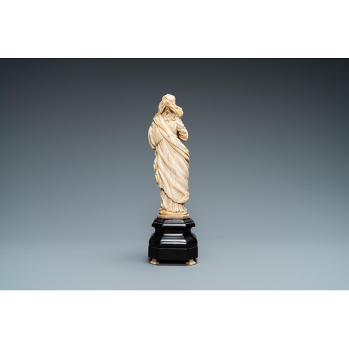 47 - An ivory figure of a Madonna on wooden stand, Flanders or Germany, 17th C.Lot subject to CITES-regul... 