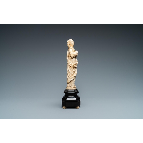 47 - An ivory figure of a Madonna on wooden stand, Flanders or Germany, 17th C.Lot subject to CITES-regul... 