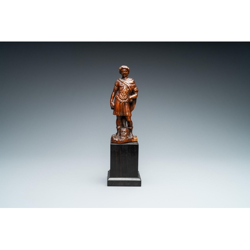 521 - A boxwood figure of David with the head of Goliath, Flanders, 17th C.H.: 29,5 cm (incl. stand)H.: 18... 