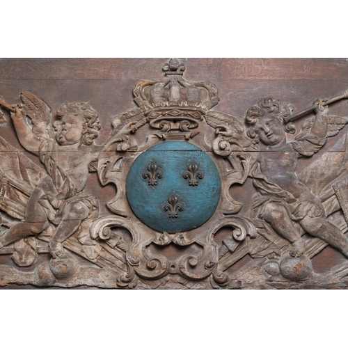 6 - A large polychromed carved oak panel with putti and trophies flanking the royal coat of arms of Fran... 