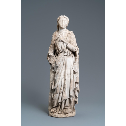 83 - A large limestone figure of Saint Barbara, 16th C.H.: 68,5 cm  Provenance: - The Davioud-Larminet co... 